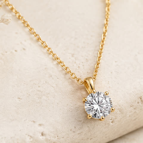 A diamond pendant on a fine gold chain.