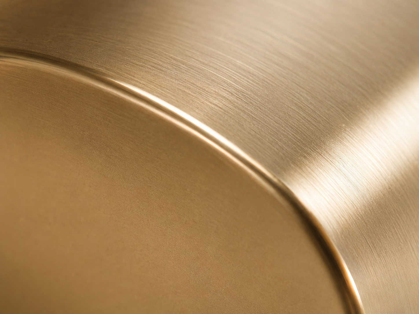 Macro comparison of fine brushed and polished gold surfaces.